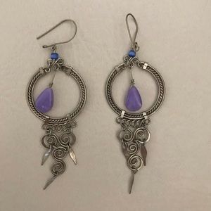 Decorative earrings with purple bead